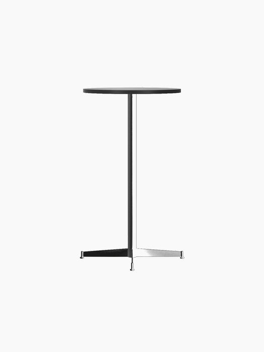 Angled view of the Nook Bar Table with a round black oak top and a black powder-coated steel base with four feet.