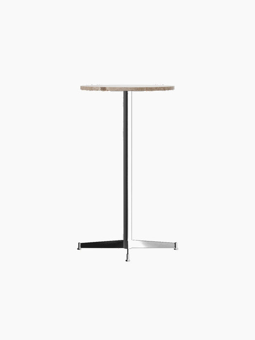 The Nook Bar Table shown at an angle, featuring a round Kunis Breccia stone top and a slender black powder-coated steel base.