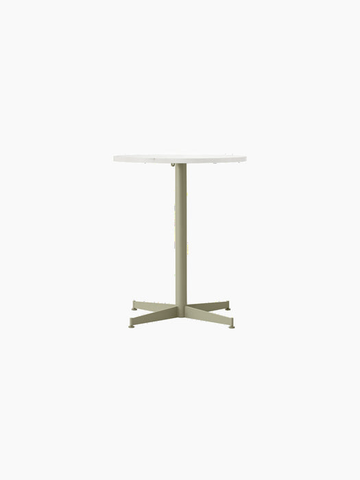 Front view of the Nook Dining Table with a round, white Estremoz marble top and an olive green, four-star steel base.