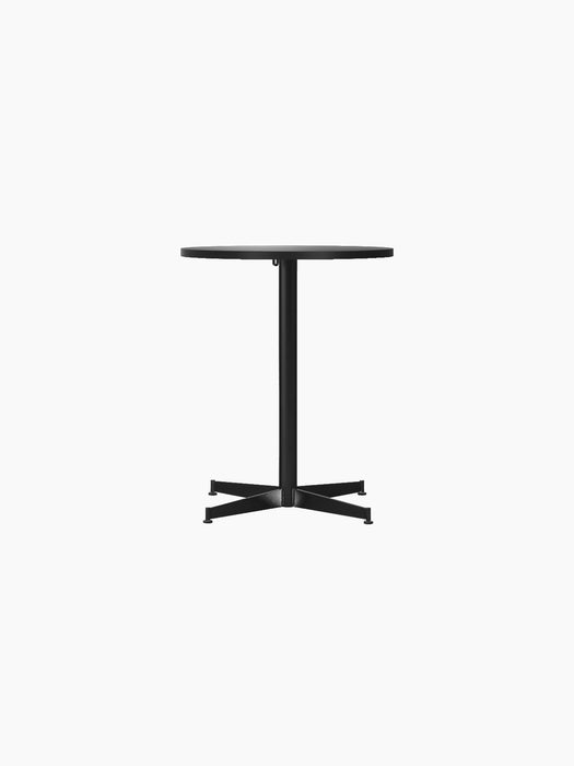 Front view of the Nook Dining Table with a round charcoal linoleum top and a slim, black powder-coated steel four-star base.