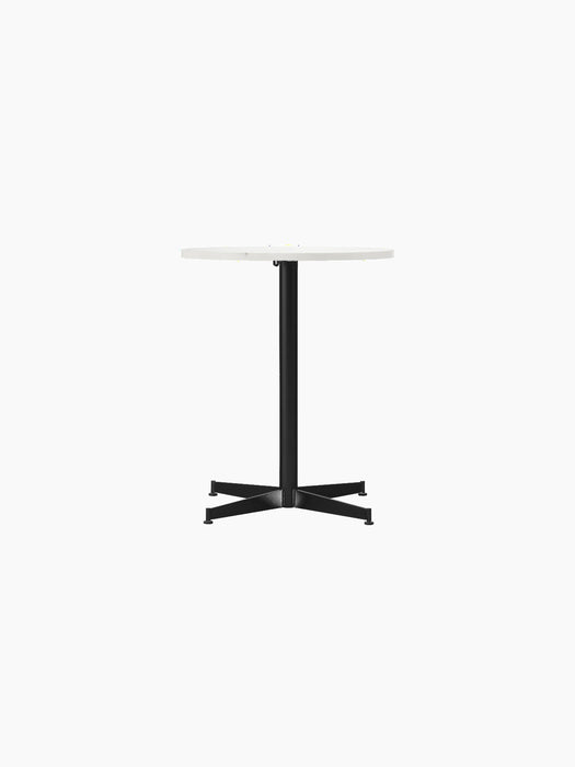 Front view of the Nook Dining Table with a round Estremoz marble top and a black powder-coated steel four-star base.