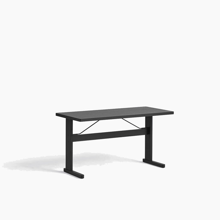 Passerelle Desk Water-based lacquered oak frame Burgundy red powder coated crossbar Adjustable gliders - HAY