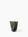 Front view of the sculptural Aer Vase 19 in dark green glass. The vase has a twisted, rippled form and a thick, clear base.