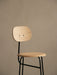 Close-up of the Afteroom Bar Chair Plus in Natural Oak veneer, showing the rounded backrest and seat on a black steel frame.
