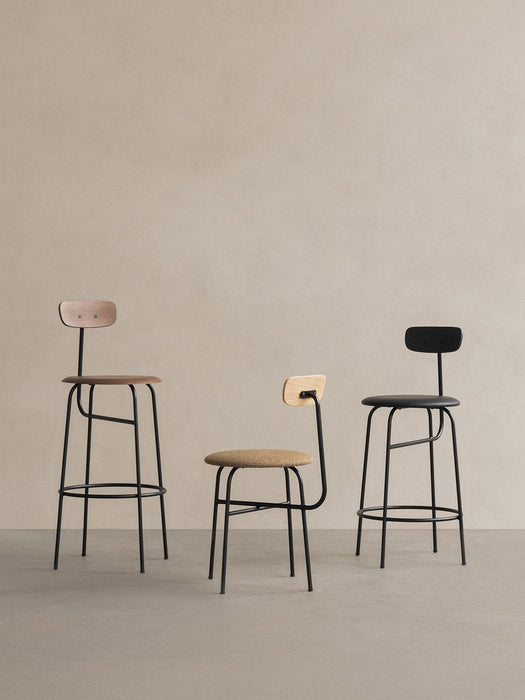 A collection of three Afteroom chairs: an Afteroom Bar Chair in oak, a dining chair, and another bar chair in black.