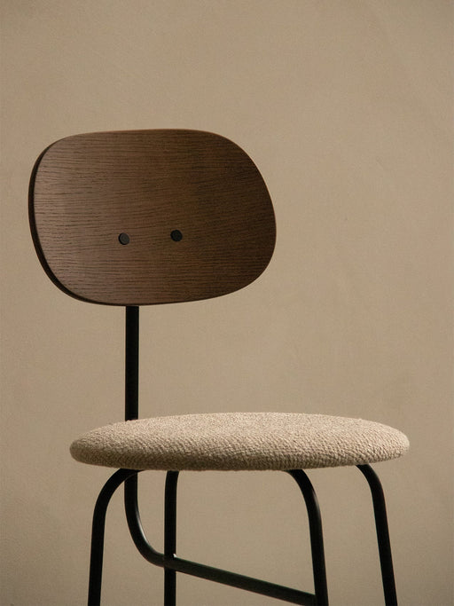 A close-up of the Afteroom Counter Chair Plus, showing the dark oak backrest, beige upholstered seat, and thin black frame.