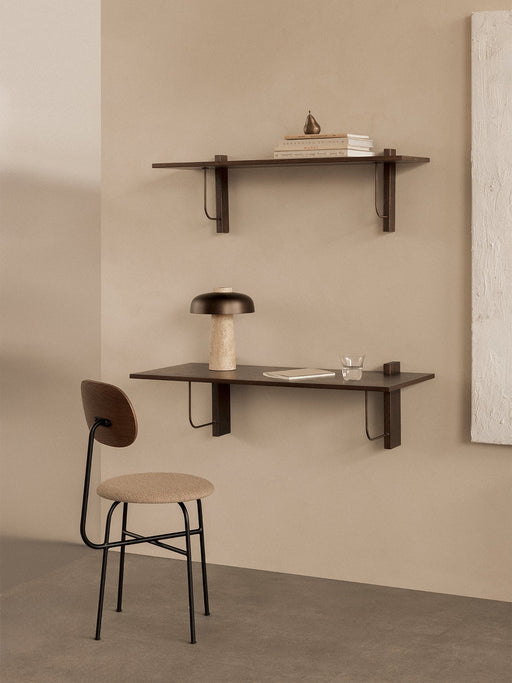 A workspace with the Afteroom Dining Chair Plus, Corbel Desk with a Reverse Lamp, and a Corbel Shelf on a beige wall.