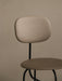 A close-up of the Afteroom Counter Chair Plus, showing its beige upholstered backrest and seat against a neutral wall.