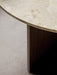 A close-up shot of the Androgyne Dining Table, showcasing the detailed texture of the round Kunis Breccia stone tabletop.