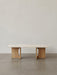 Front view of the Androgyne Lounge Table with a natural oak wood base and a light-coloured Kunis Breccia stone tabletop.