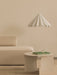 A beige living room with a textured Eave Modular Sofa, an ivory Androgyne Side Table, and a white, pleated Dancing Pendant.