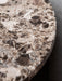 Androgyne Side Table with Emperador Marble top. A close-up view showcasing the beautiful brown, cream and dark veining.