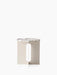 Front view of the Androgyne Side Table featuring a round Calacatta Viola marble top on a sculptural ivory metal base.