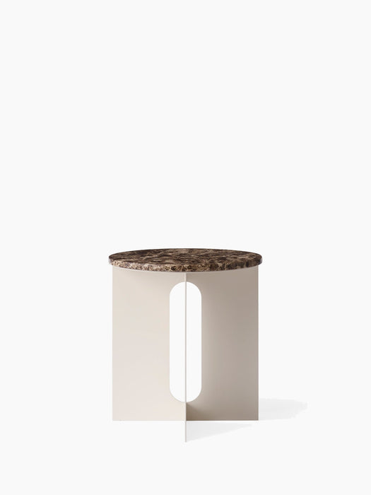 Front view of the Androgyne Side Table, featuring a round Emperador Marble top and an ivory base with a vertical cutout.