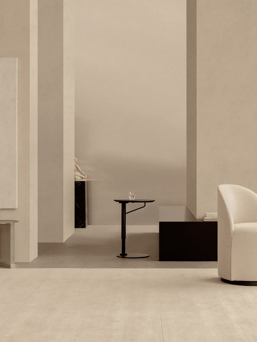 A Branch Side Table in dark stained oak in a minimalist room with Tearoom Side Chair, Androgyne Side Table, and Plinth Tall.