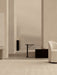 A Branch Side Table in dark stained oak in a minimalist room with Tearoom Side Chair, Androgyne Side Table, and Plinth Tall.
