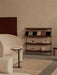 A Branch Side Table next to a Tearoom Sofa High Back, with a Zet Storage System and Passage Stool in a neutral-toned room.
