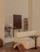 Black Branch Side Table beside an Eave Modular Sofa. The background shows a Co Table, Co Task Chair, and Torso Table Lamp.