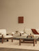 A neutral living room, cream Brasilia Lounge Chair and Sofa, Brasilia Lounge Table, and Interconnect Candle Holder.