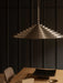 The brushed aluminium Chancery Pendant Lamp hangs over an Androgyne Dining Table, with a Co Task Chair seen to the side.