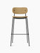 Front view of the Co Bar Chair, Fully Upholstered. It has a black steel frame and light brown Audo Bouclé 06 upholstery.
