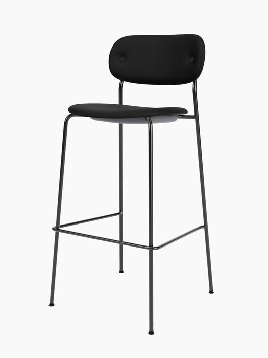 An angled view of the Co Bar Chair, Fully Upholstered, with a black seat and backrest on a slender black steel frame.