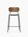 Front view of the Co Bar Chair with a dark stained oak backrest, cream bouclé upholstered seat, and a black steel frame.