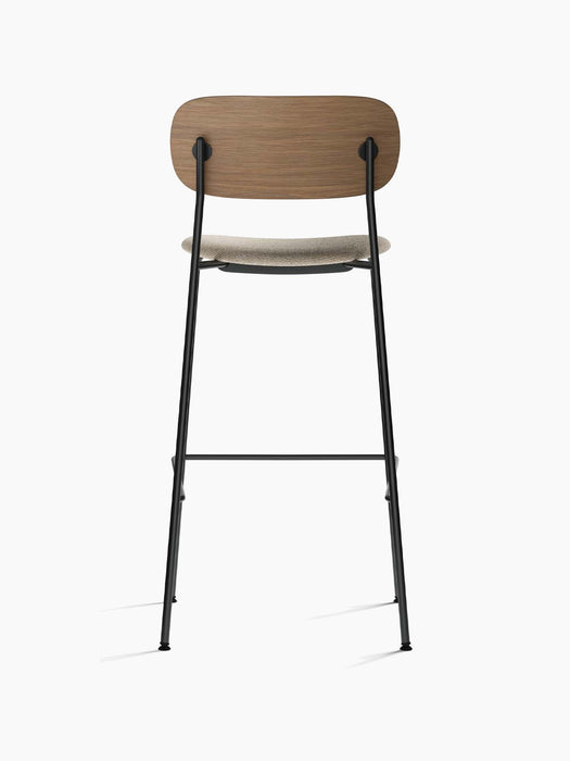 Back view of the Co Bar Chair, Seat Upholstered with dark stained oak backrest, moss upholstered seat and black steel frame.