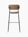 Back view of the Co Bar Chair, Seat Upholstered with dark stained oak backrest, moss upholstered seat and black steel frame.