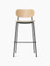 Front view of the Co Bar Chair with a natural oak backrest, cream bouclé upholstered seat, and a slender black steel frame.