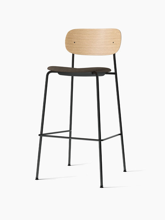 Co Bar Chair, Seat Upholstered, with a natural oak backrest and dark fabric seat on a slender black steel frame.