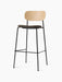 Co Bar Chair, Seat Upholstered, with a natural oak backrest and dark fabric seat on a slender black steel frame.