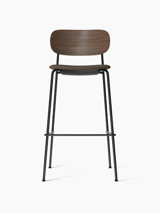 Front view of Co Bar Chair, Seat Upholstered with dark stained oak backrest, grey upholstered seat, and black steel frame.