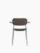 Front view of the Co Dining Chair, fully upholstered in dark textured fabric with black oak armrests and a chrome frame.