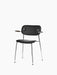 An angled view of the Co Dining Chair, fully upholstered in black leather with dark stained oak armrests and a chrome frame.