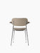 Back view of the Co Dining Chair with armrests. Fully upholstered in sand fabric with a chrome frame and dark oak armrests.
