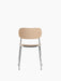 Front view of the Co Dining Chair, featuring a natural oak veneer seat and backrest on a slender, polished chrome frame.