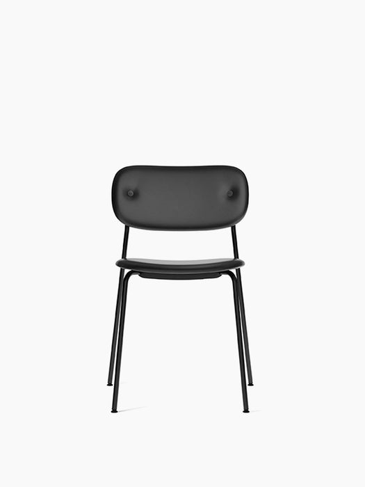 Front view of the Co Dining Chair, fully upholstered in black Dakar leather, with a slender black powder-coated steel frame.