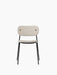 A front view of the Co Dining Chair, fully upholstered seat and back in a light, textured fabric, with a slim black frame.