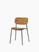 Front-angle view of the Co Dining Chair with tan leather upholstered seat and backrest on a slim black steel frame.