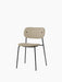 Angled view of the Co Dining Chair, fully upholstered in Audo Bouclé 02 fabric with a slim, black powder-coated steel frame.