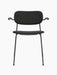 A front view of the Co Dining Chair, fully upholstered with armrests in black. The chair features a slim black metal frame.