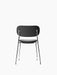 Rear view of Co Dining Chair, fully upholstered in black with a slender, polished chrome frame, against a white background.