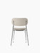 Back view of the Co Dining Chair, fully upholstered in a light beige fabric with a sleek, minimalist chrome frame.