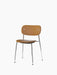 The Co Dining Chair shown at an angle, featuring tan leather upholstery on the seat and back, set on a slender chrome base.