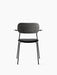 Front view of the black Co Dining Chair with armrests, a black oak backrest, an upholstered seat and a slim metal frame.