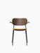 Front view of the Co Dining Chair with armrest, featuring a dark stained oak backrest, mustard seat, and black frame.