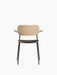 Front view of the Co Dining Chair with a black frame, natural oak backrest and armrests, and a dark, upholstered seat.