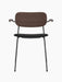 Front view of Co Dining Chair with black frame, black upholstered seat, dark stained oak veneer backrest and armrests.