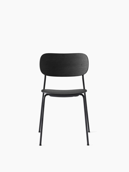 A front view of the Co Dining Chair with black steel frame and black oak veneer seat and back, shown on a white background.
